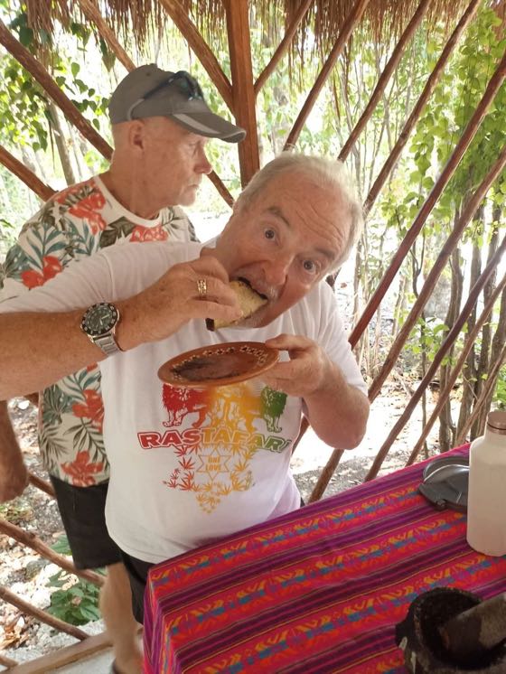 A guest happily biting a fresh tortilla