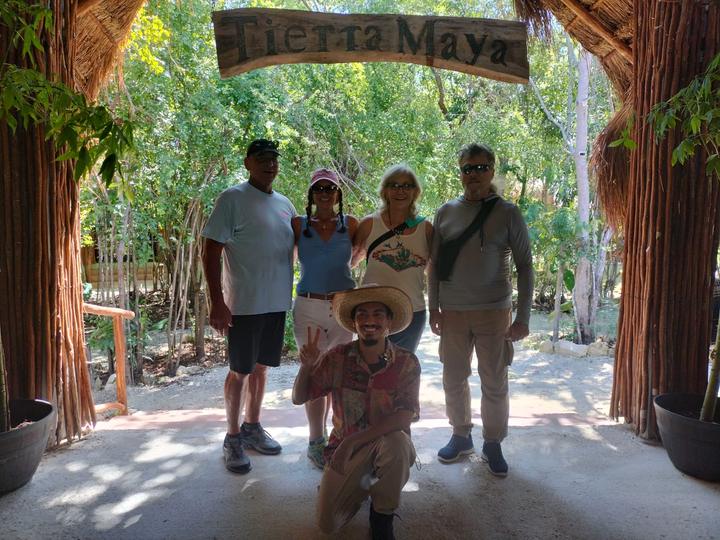 Four guests with guide kneeling in a sombrero